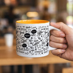 Cora Coffee Mug featuring a two-toned design with coffee-related graphics, perfect for corporate gifts.