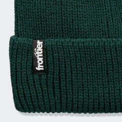 Frontier Ridge Beanie featuring a woven logo label, made from 100% recycled polyester, perfect as a corporate gift.