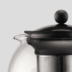 Bodum Assam Tea Press close-up showing the glass teapot lid and stainless steel infuser.
