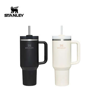 Black and cream Stanley Quencher tumblers shown with side handles, narrow bases, lids and straws