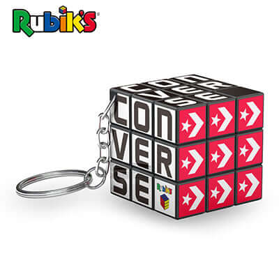 Rubik’s 3×3 keychain with black cube, printed campaign faces and metal split ring