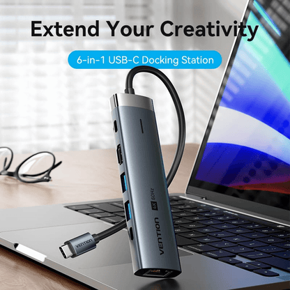 Vention 6-in-1 USB-C Docking Station with HD Display connected to a laptop.