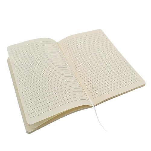 White A5 notebook opened to ruled pages with ribbon bookmark across the centre.