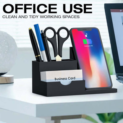 Wireless charging pen holder on an office desk with phone, pens, scissors and business cards
