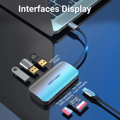Vention 6-in-1 USB-C Hub connected to a laptop, showcasing USB ports and card reader features.