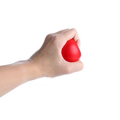 Hand squeezing a red round stressball