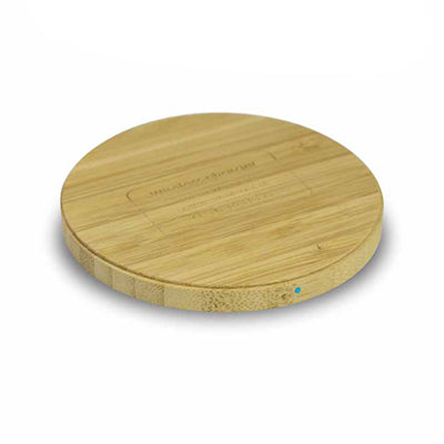 Low-profile round bamboo wireless charging pad with side connection port