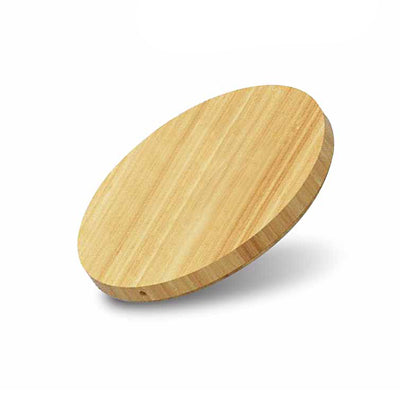 Angled view of the round charging pad showing its bamboo grain surface