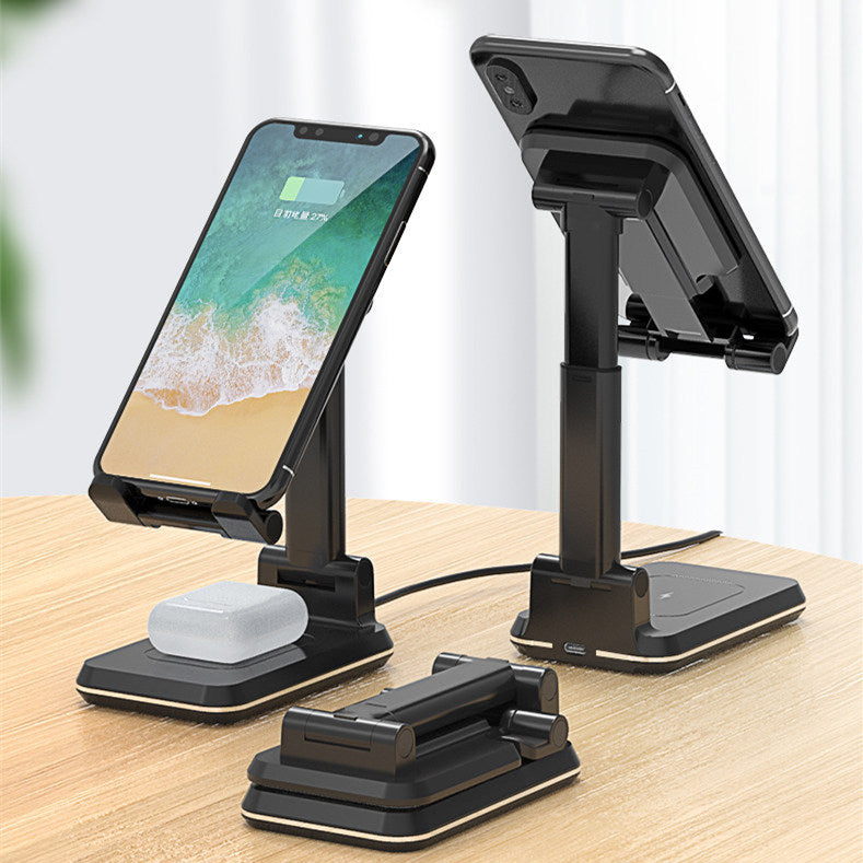 Black dual charging stand shown upright with demonstration devices and folded flat on a desk