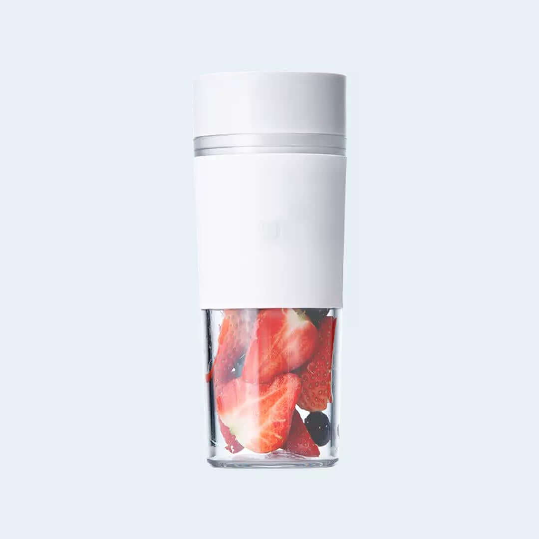 White Xiaomi Mijia portable blender with transparent cup shown containing example fruit