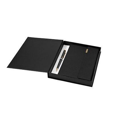Balmain black notebook and gold-trimmed ballpoint pen presented in an open black gift box.