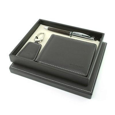 Balmain pen, key holder and stitched wallet arranged in a presentation gift box.