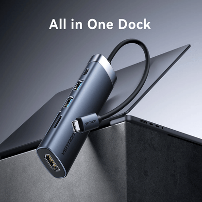 Vention 6-in-1 USB-C Docking Station with HDMI connected to a laptop, showcasing all-in-one functionality.