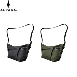 ALPAKA Flow Satchel Sling Bag in black and green, perfect corporate gift for versatile organization.