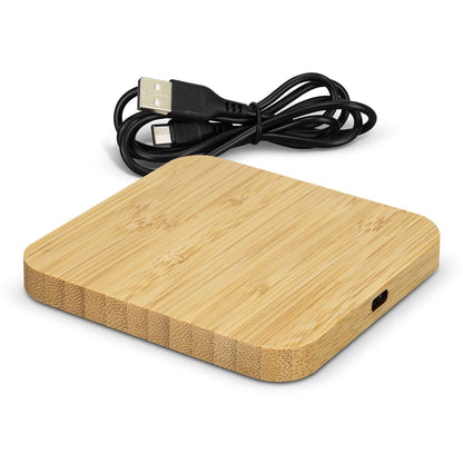 Square NATURA bamboo wireless charging hub with rounded corners, side input port and a black USB-A to USB-C cable