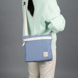 Crossing Remi Crossbody Bag worn by a person, showcasing style and functionality, ideal as a corporate gift.