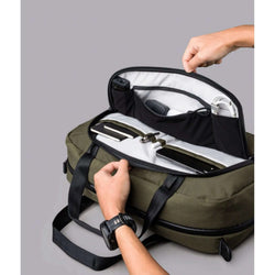 ALPAKA Bravo Brief showing interior organization with multiple pockets for cables and accessories.