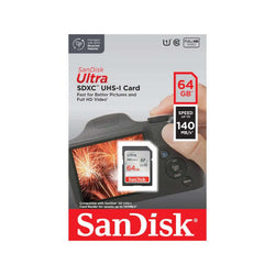 SanDisk Ultra SDXC 64GB UHS-I Card [SDSDUNB-064G-GN6IN] packaging with camera and fireworks background