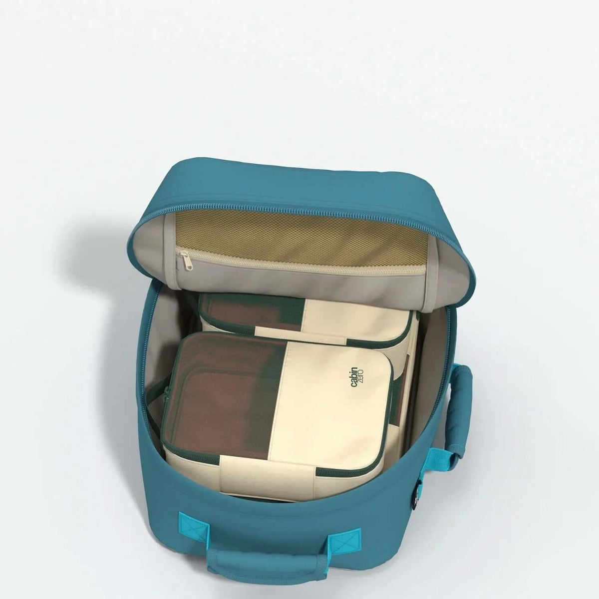 Cabinzero Classic Backpack 28L interior showing organized storage compartments and zippered pocket.