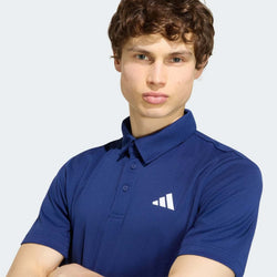 Adidas Tennis Fab Polo Tee modeled by a man wearing a blue polo with the Adidas logo, perfect for corporate gift.