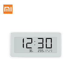 Xiaomi Temperature and Humidity Monitor Clock displaying time and temperature readings in a sleek design.